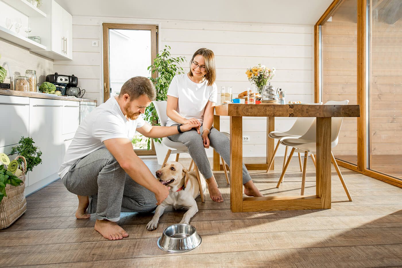Couple with dog living in their new home